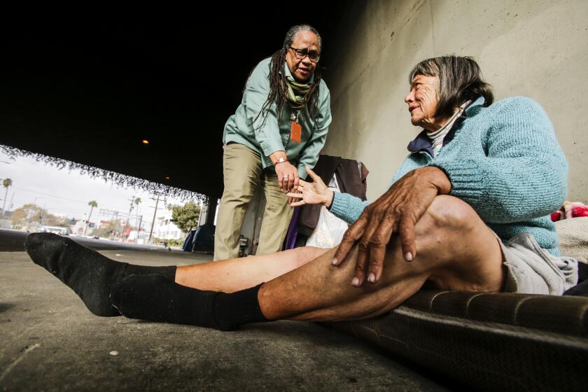 Jeanette Rowe, left, meets Beverly Walker, who was living on a sidewalk in Los Angeles.