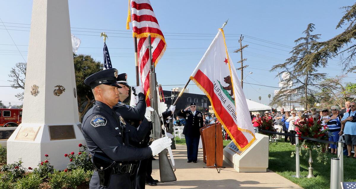 Members of the Burbank Police Department participated in the Presentation of Colors during the dedication ceremony of the war memorial at McCambridge Park on Monday.