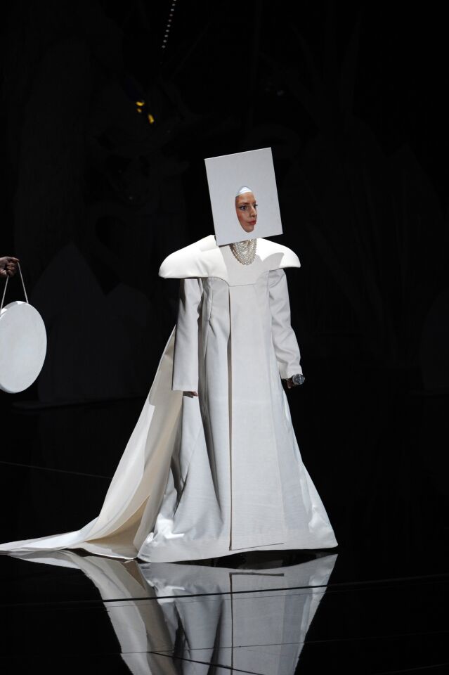 Lady Gaga started out the night's onstage activities with a costume-swapping performance.