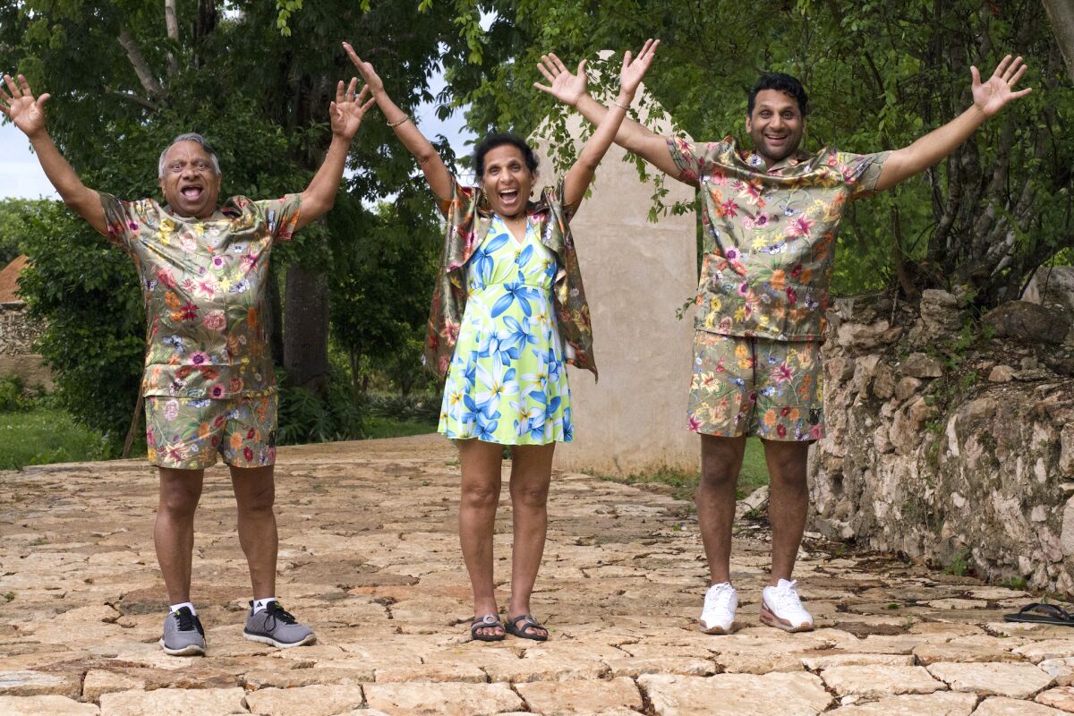 Ravi Patel, far right, and his parents Vasant and Champa pose in matching outfits in Mexico.
