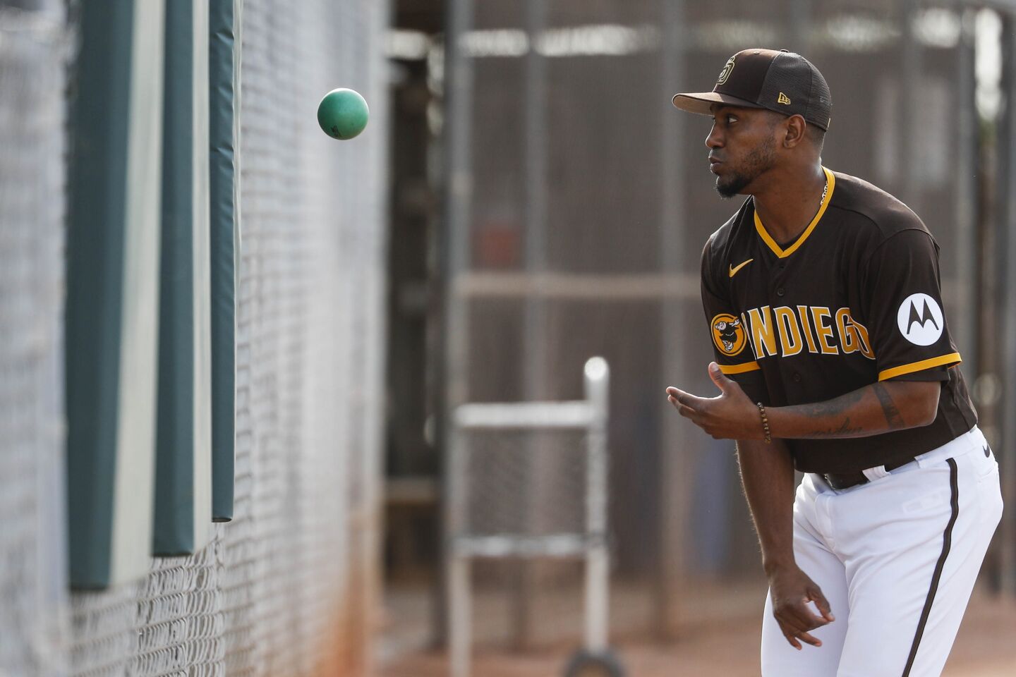 Padres pitcher Julio Teheran throws a medicine ball during a spring training practice at Peoria Sports Complex on Friday.