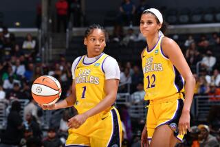 Zia Cooke dribbles and Rae Burrell looks up court during the Sparks' lopsided loss to the Liberty