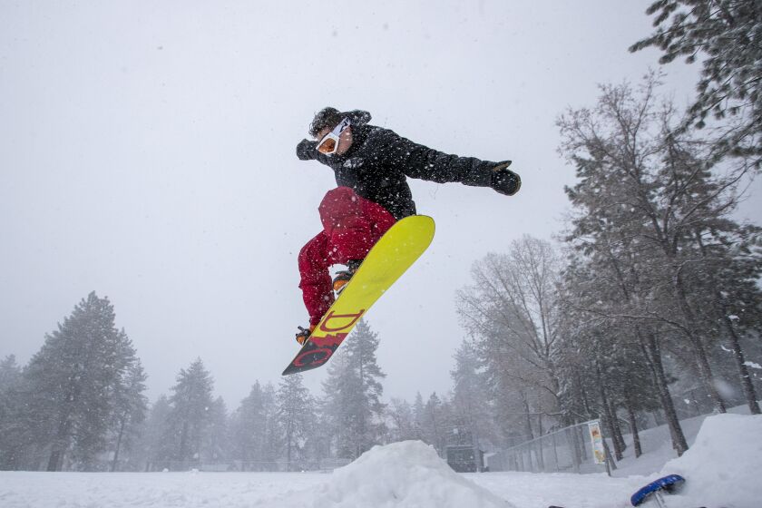 Snowboarder Malcolm Pope of Carlsbad catches air in Wrightwood, Calif., on Nov. 27, 2019.