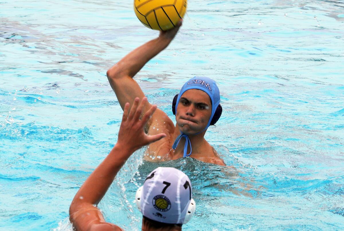 CdM's Jackson Harlan (8) competes against Newport Harbor during the third-place match of the South Coast Tournament. 