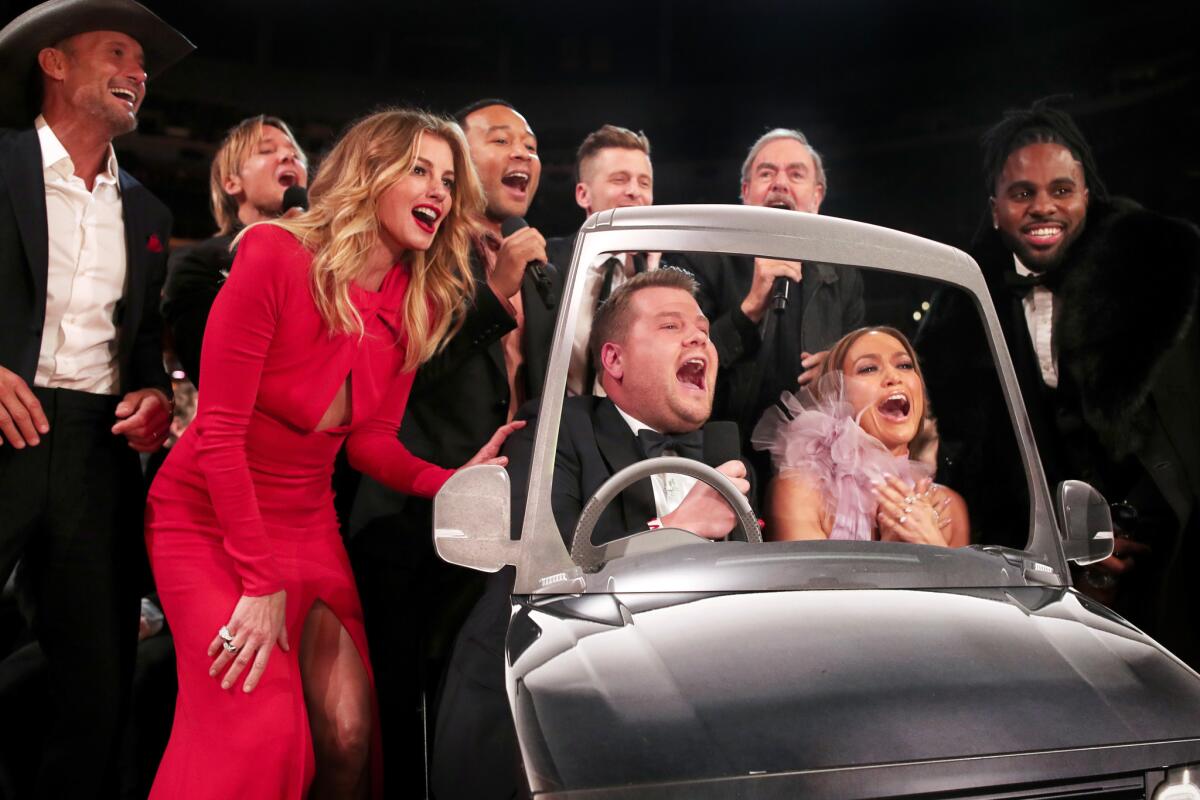 James Corden and Jennifer Lopez, surrounded by, from left, Tim McGraw, Keith Urban, Faith Hill, John Legend, OneRepublic's Ryan Tedder, Neil Diamond and Jason Derulo for a Grammys' version of Carpool Karaoke.