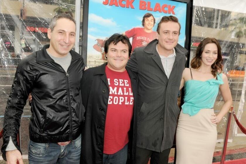 From left, director Rob Letterman, actors Jack Black, Jason Segel and Emily Blunt arrive at the premiere of 20th Century Fox's "Gulliver's Travels."