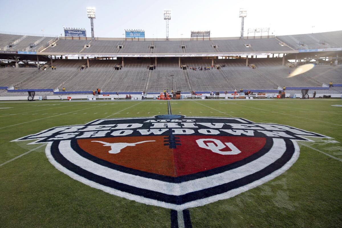 The Red River Showdown logo is displayed on the field of the Cotton Bowl.