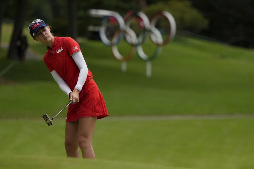 Nelly Korda, of the United States, follows her ball on 16 green during the final.