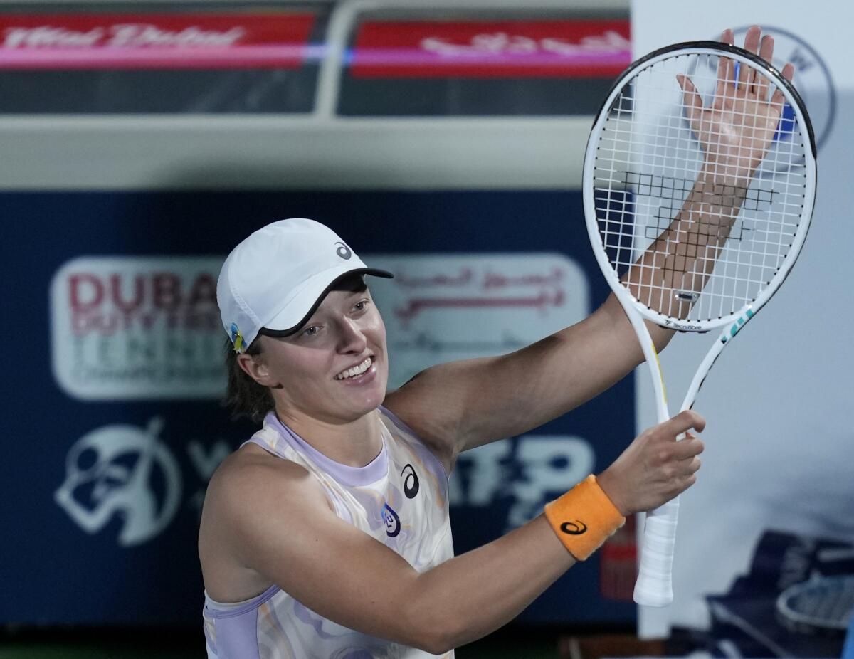 Iga Swiatek celebrates after she beats Coco Gauff during their semifinal match of the Dubai Duty Free Tennis Championships.