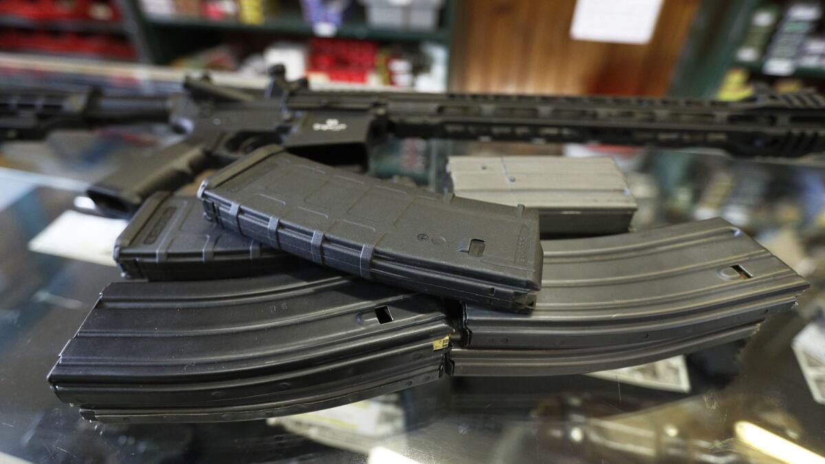 High-capacity clips for AR-15-style rifles are shown at a gun store in Utah on Feb. 15.