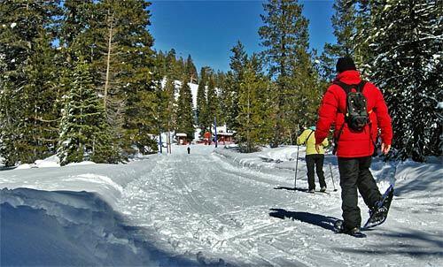 Snowshoers and cross-country skiers share groomed trails at Royal Gorge Cross Country Ski Resort in Soda Springs, Calif.