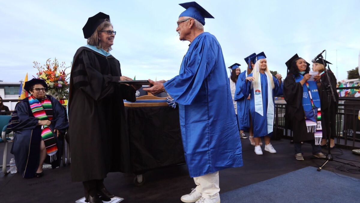 Isler receives his diploma at Santa Monica College.