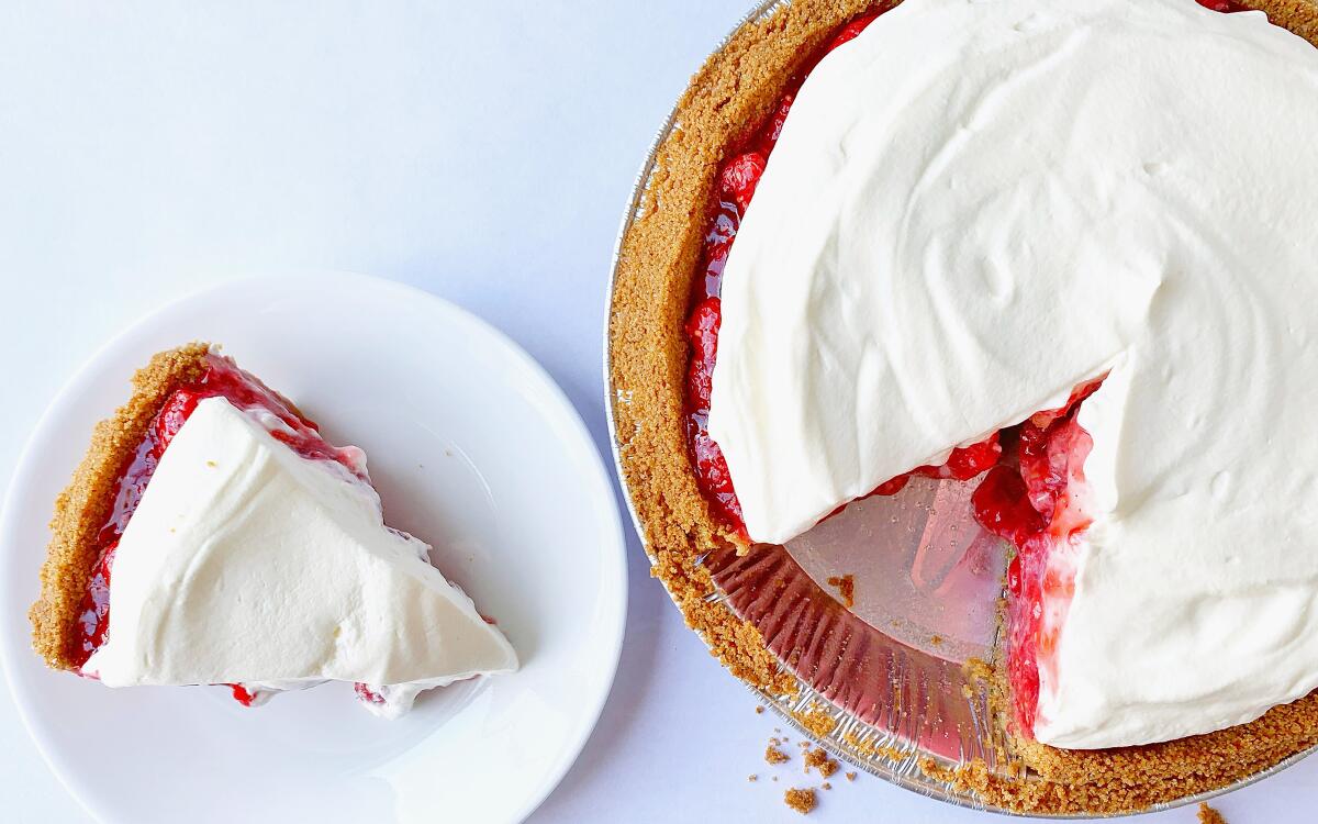 Fresh, raw raspberries pile into a crunchy graham cracker crust and get a blanket of whipped cream.