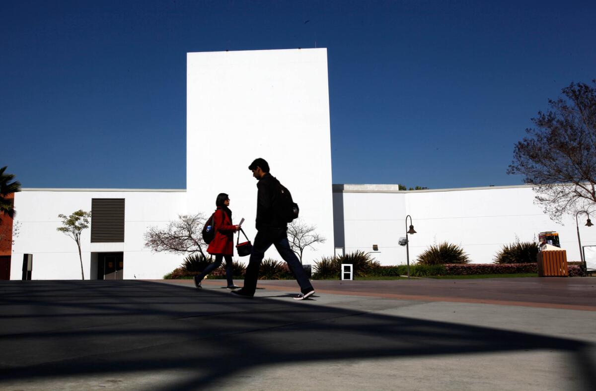 Students walk on the Cal State L.A. campus. The school has been awarded a $5-million NASA grant to establish a new research center focused on the study of hydrology, climate change and other science and technology fields.