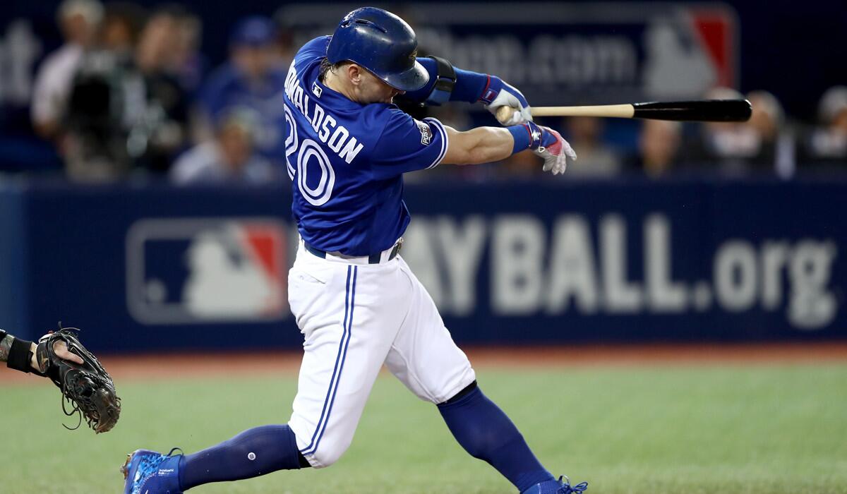 Toronto Blue Jays' Josh Donaldson hits a solo home run in the third inning against the Cleveland Indians during Game 4 of the ALCS Tuesday.