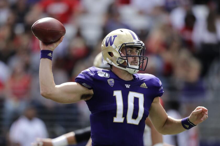 Washington quarterback Jacob Eason passes against Eastern Washington in the first half of an NCAA college football game Saturday, Aug. 31, 2019, in Seattle. (AP Photo/Elaine Thompson)