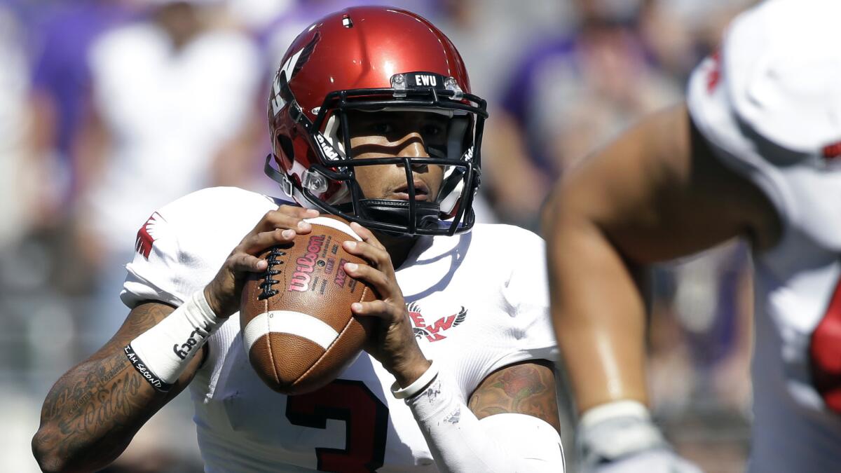 Eastern Washington quarterback Vernon Adams Jr.,left, looks to throw against Washington during a game on Sept. 6. Adams announced Monday he is transferring to Oregon.