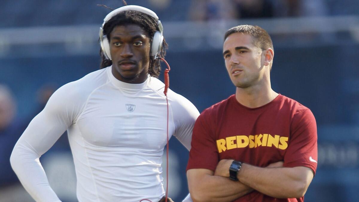 Matt LaFleur, right, worked with quarterback Robert Griffin III when LaFleur was the quarterbacks coach for the Washington Redskins. LaFleur is the Rams' new offensive coordinator.