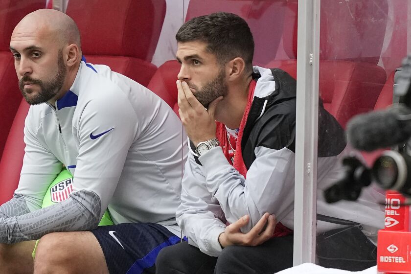 Christian Pulisic follows the game from the bench during the international friendly soccer match between USA and Japan as part of the Kirin Challenge Cup in Duesseldorf, Germany, Friday, Sept. 23, 2022. (AP Photo/Martin Meissner)