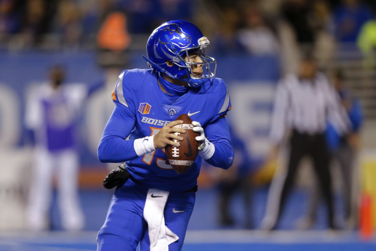 Boise State quarterback Hank Bachmeier looks for a receiver during the second half of the team's NCAA college football game against Air Force on Saturday, Oct. 16, 2021, in Boise, Idaho. Air Force won 24-17. (AP Photo/Steve Conner)