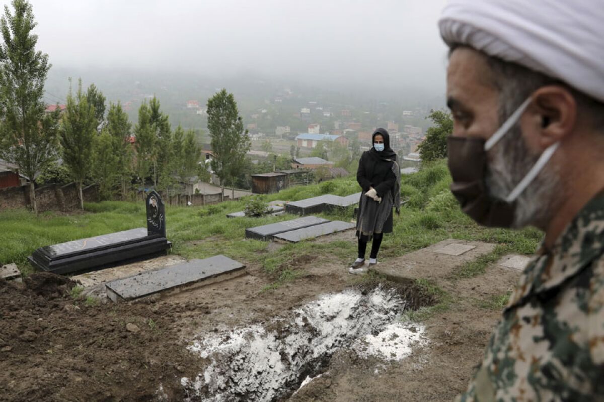 A woman visits the grave of her mother in the northern Iranian city of Babol. 