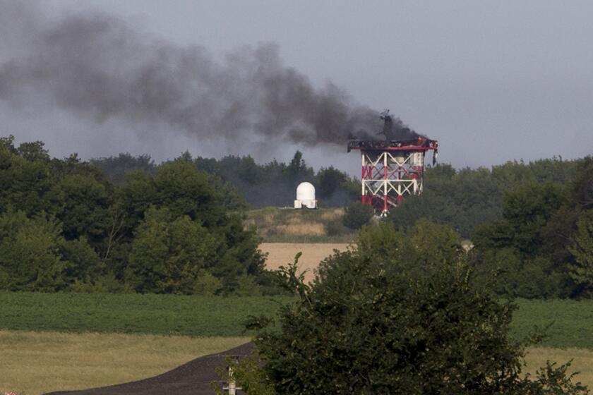A radar tower burns after fighting in recent days between pro-Russia militants and Ukrainian government forces near Sergei Prokofiev International Airport in Donetsk, in eastern Ukraine.