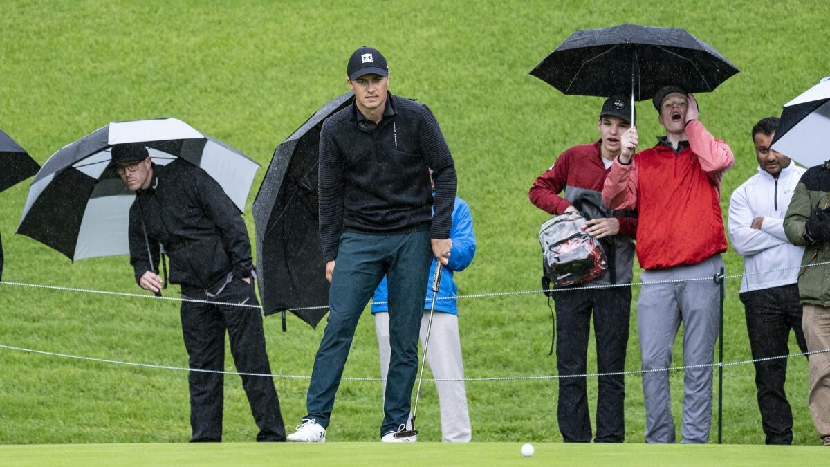 Fans react as Jordan Spieth just misses a birdie on the 18th hole during the first round of the Genesis Open at Riviera Country Club.