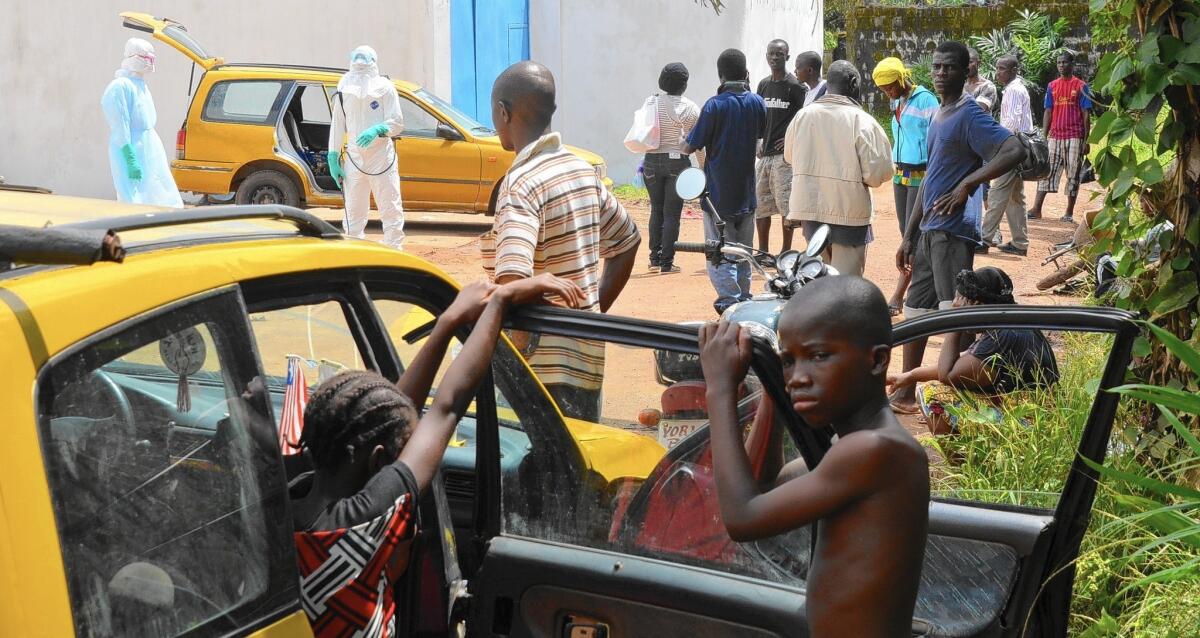 An Ebola patient arrives by taxi at a treatment center in Monrovia, the Liberian capital. The Ebola virus has become entrenched among the human population of West Africa, a panel of World Health Organization experts concludes.