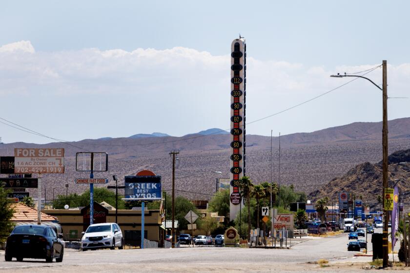 BAKER, CA - JULY 19, 2024: The World's Largest Thermometer reads 112 degrees as the heat wave continues in Southern California on July 19, 2024 in Baker, CA.(Gina Ferazzi / Los Angeles Times)
