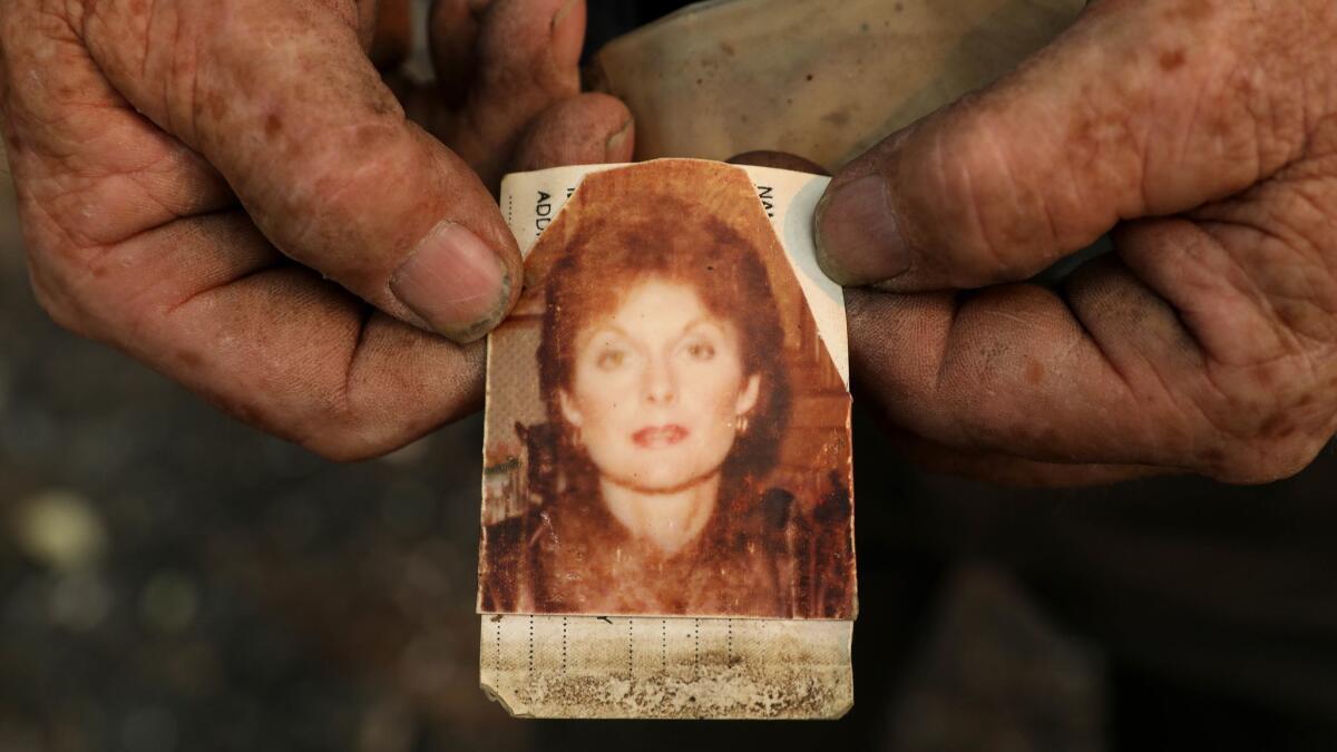 Ed Bledsoe holds a photo of his deceased wife Melody Bledsoe, taken when she was in her 50s. Melody Bledsoe, 70, and great-grandchildren, Emily Roberts, 5, and James Roberts, 4, were killed when their Redding home burned in the Carr fire.