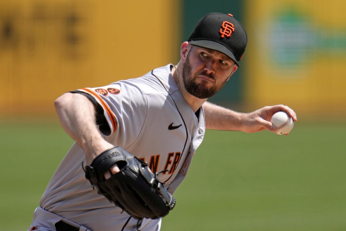 FILE - San Francisco Giants starting pitcher Alex Wood delivers during the first inning of a baseball game against the Pittsburgh Pirates in Pittsburgh, Sunday, July 16, 2023. Wood has agreed to an $8.5 million, one-year contract with the Oakland Athletics, who also acquired right-hander Ross Stripling and cash from the San Francisco Giants, the teams announced Friday, Feb. 2, 2024. (AP Photo/Gene J. Puskar, File)