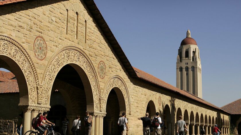 A Stanford admissions official was arrested Sunday on suspicion of attempted murder in a domestic violence case.