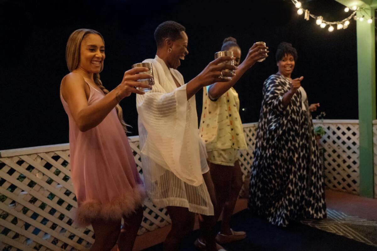 The cast of "Insecure" shares a toast.