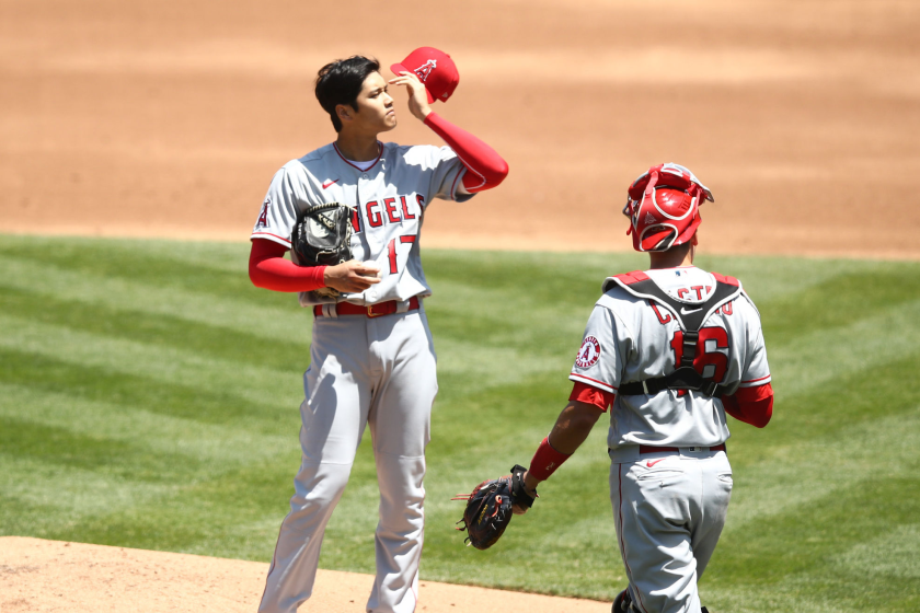 Angels catcher Jason Castro comes out to talk to Shohei Ohtani during the first inning.