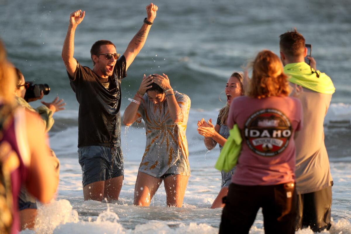 A worshiper is baptized at a Saturate O.C. event in Huntington Beach
