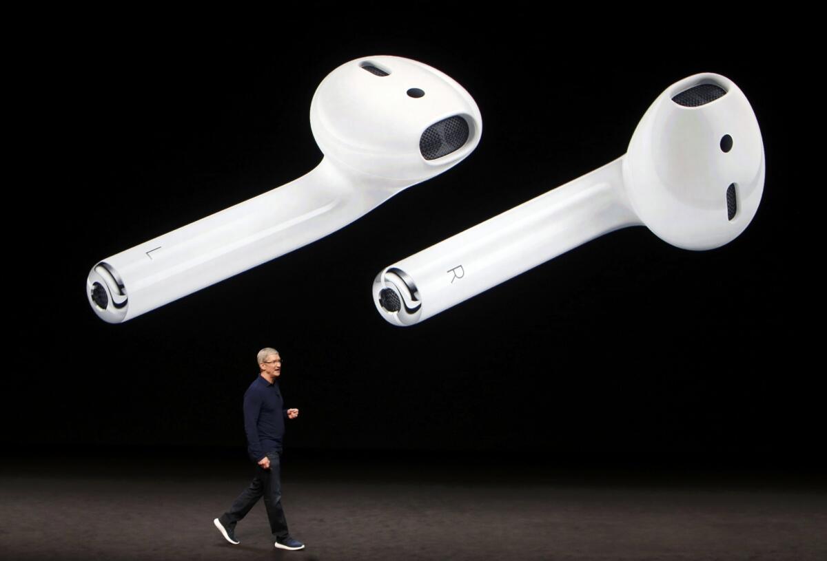AirPods are displayed as Apple Inc CEO Tim Cook makes his closing remarks during an Apple media event in San Francisco, California, U.S. September 7, 2016.
