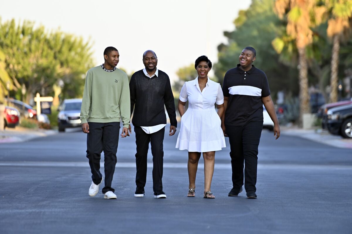 The Shelton family, who all voted for joe Biden and Kamala Harris, walk through their suburban Las Vegas neighborhood.