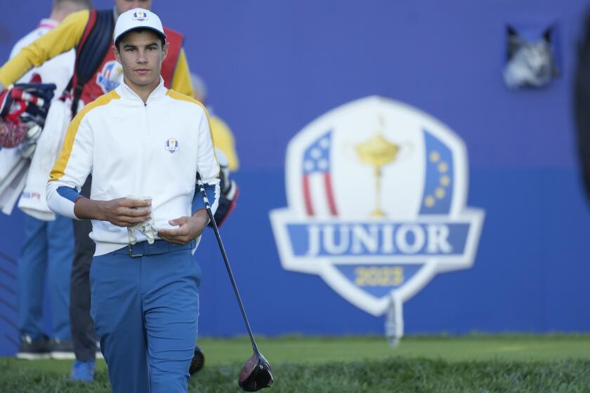 Europe's Lev Grinberg, of the Ukraine, walks off the 1st tee as he takes part in the Junior Ryder Cup golf tournament at the Marco Simone Golf Club in Guidonia Montecelio, Italy, Thursday, Sept. 28, 2023. The Ryder Cup starts Sept. 29, at the Marco Simone Golf Club. (AP Photo/Andrew Medichini)