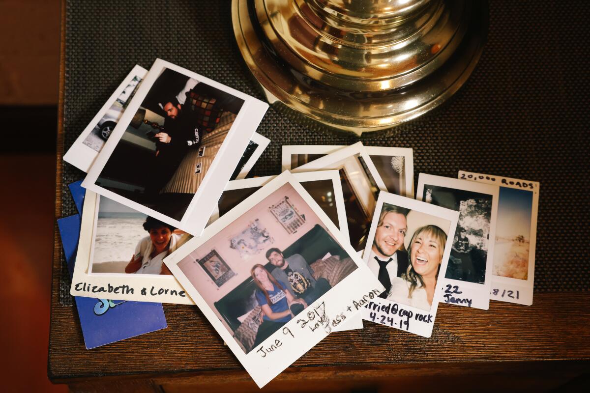 instant photos on a night stand 