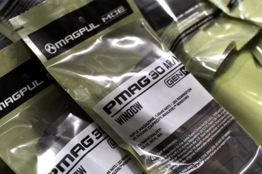 Newly packaged 30-round-capacity ammunition magazines for high-velocity rifles await shipment from the Magpul Industries plant in Erie, Colo. Magpul's chief executive, Richard Fitzpatrick, has threatened to pull his company out of Colorado should state lawmakers pass a bill restricting the size of ammunition magazines.