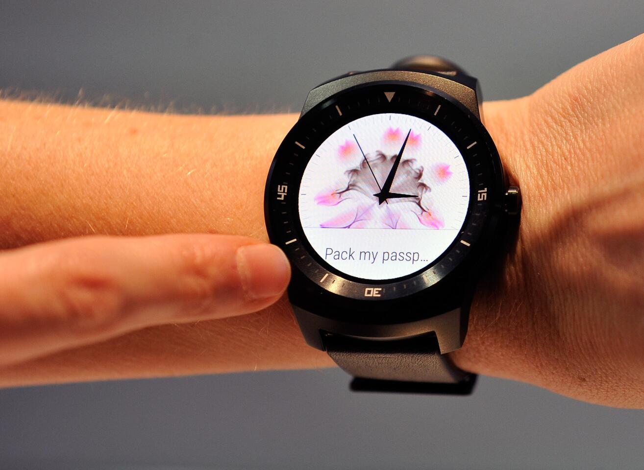 The LG G Watch R is shown during the 2015 International CES in January. Users say they enjoy the non-techie look of the watch because the device blends in as if it were a normal timepiece.