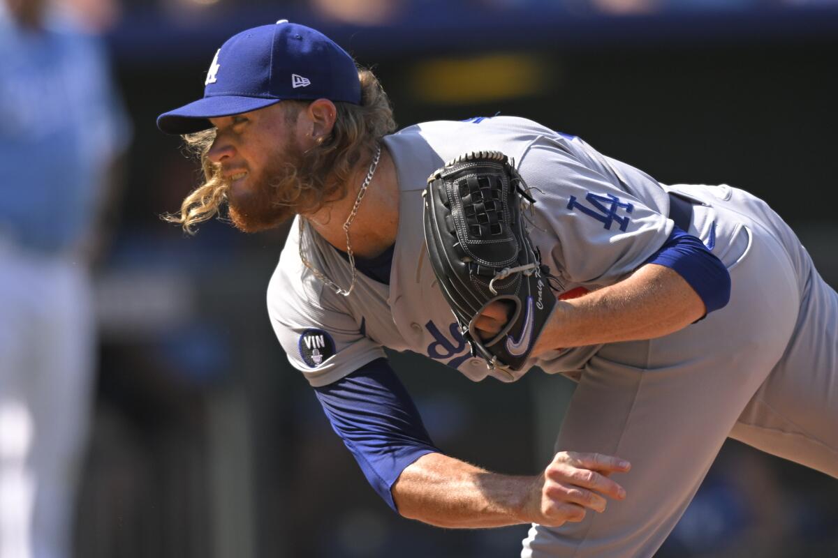 Dodgers relief pitcher Craig Kimbrel throws to a Kansas City Royals batter.