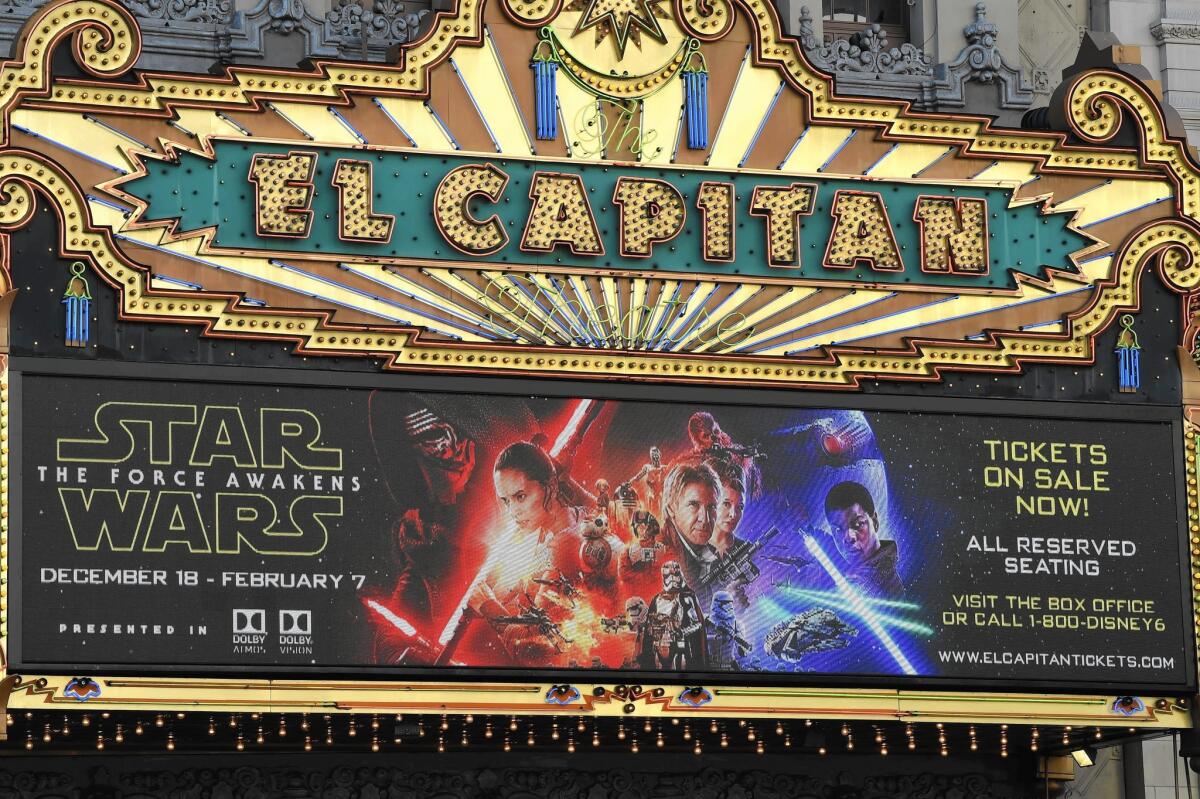 "Star Wars: The Force Awakens" is expected to gross $175 million to more than $200 million in the U.S. and Canada in its opening weekend. Above, the El Capitan theater in Hollywood promotes soon-to-be-released flim.