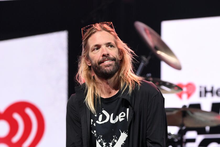 Taylor Hawkins of Foo Fighters sits onstage during an interview