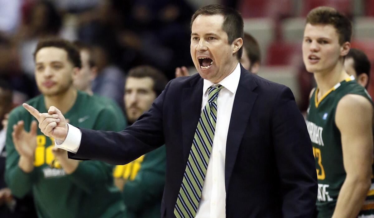 Wright State head coach Billy Donlon shouts to his team during the second half of a game against Oakland in the Horizon League tournament on March 7.