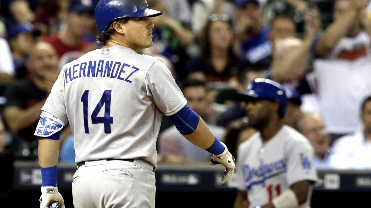 Dodgers second baseman Enrique Hernandez heads for the dugout after striking out against Astros starter Mike Fiers in the eighth inning Friday night in Houston.