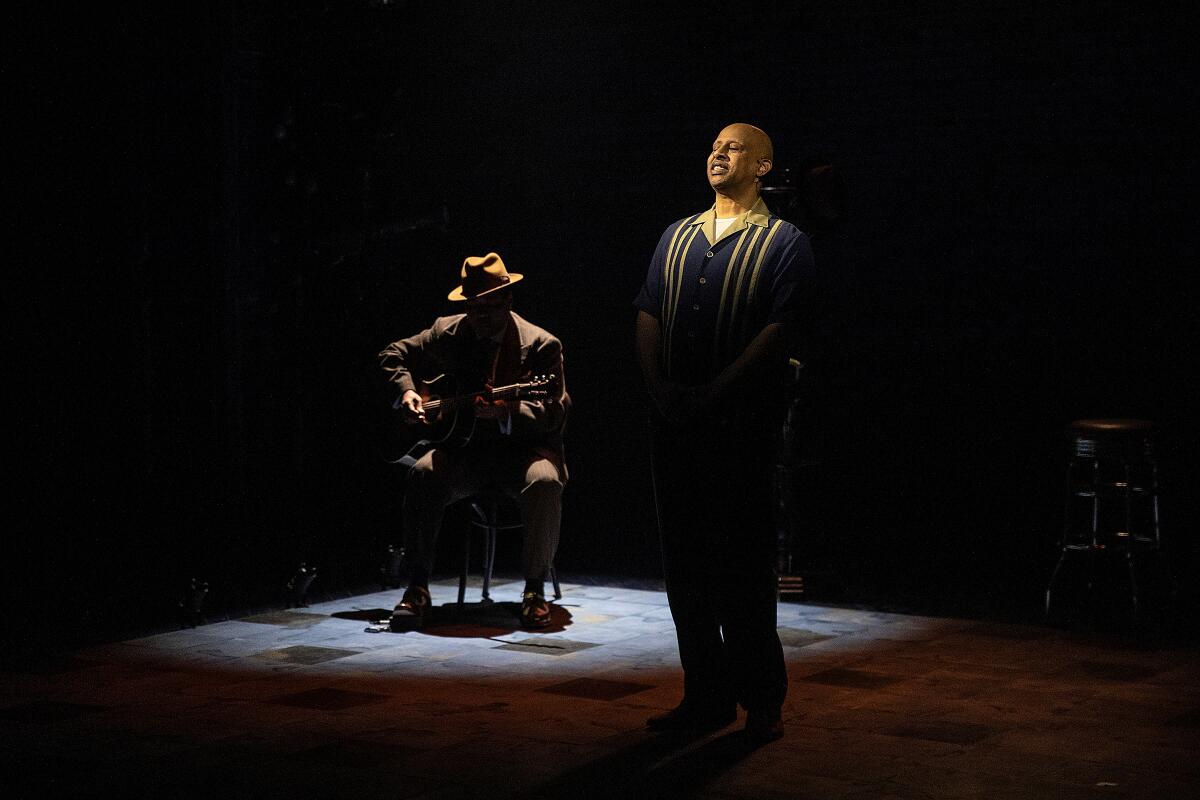 Ruben Santiago-Hudson rehearses "Lackawanna Blues." Seated in shadow is guitarist Chris Thomas King.