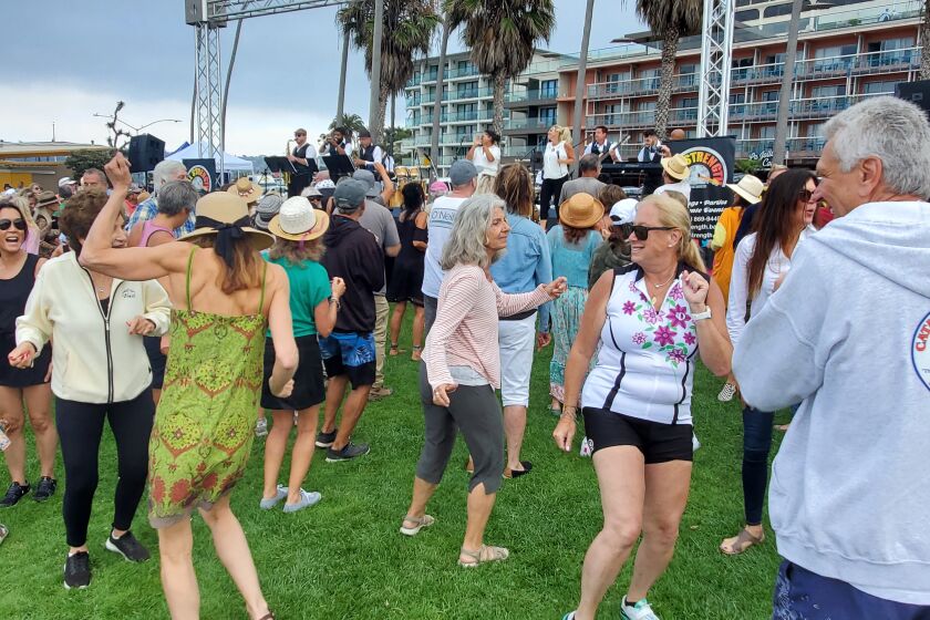 Dancers twist and shout to the tunes of Full Strength in Scripps Park in La Jolla on July 17.