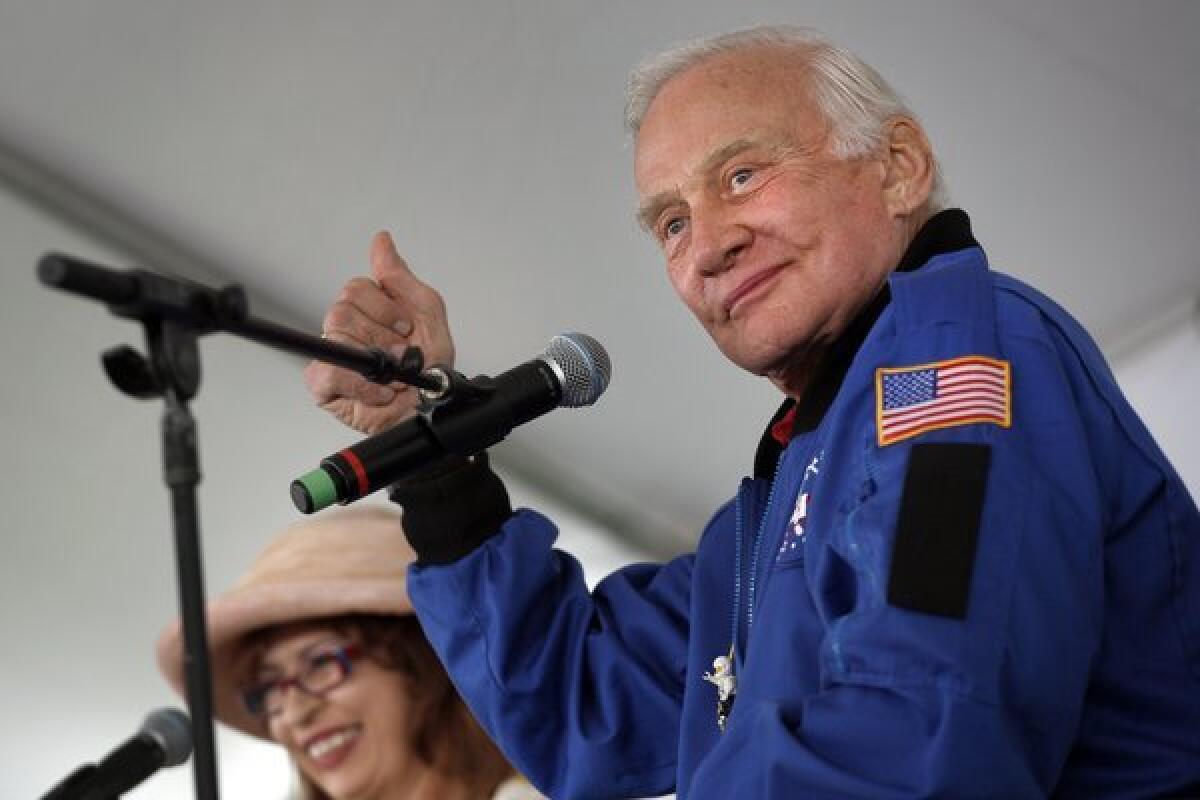 Legendary astronaut Buzz Aldrin, shown during a 2010 interview with The Times' Patt Morrison, has been named grand marshal of the 2013 Hollywood Christmas Parade.