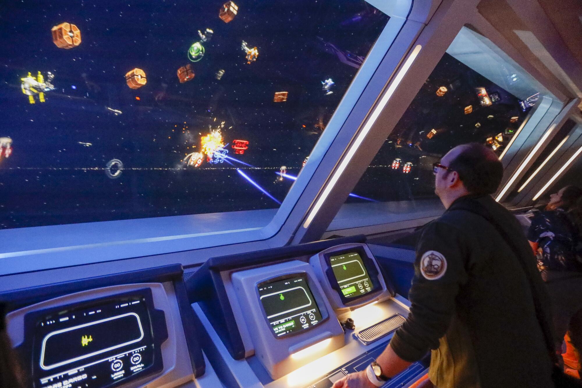 Times game critic Todd Martens fires lasers and missiles from the bridge of the Star Wars: Galactic Starcruiser. 